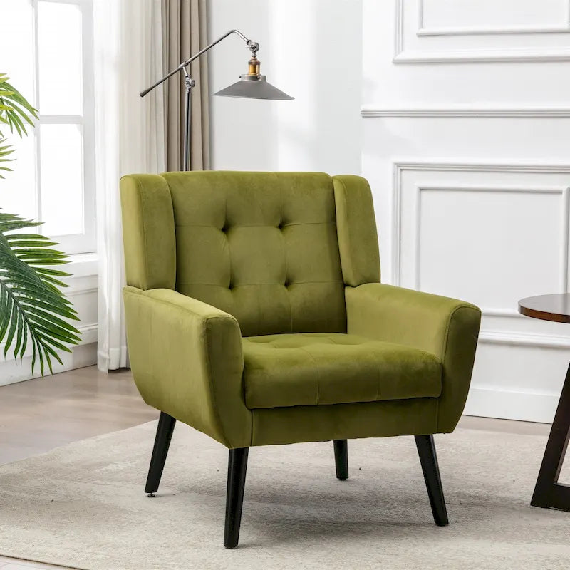 Poltroncina di design in velluto verde con gambe in legno nero, a sedile singolo