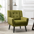Poltroncina di design in velluto verde con gambe in legno nero, a sedile singolo