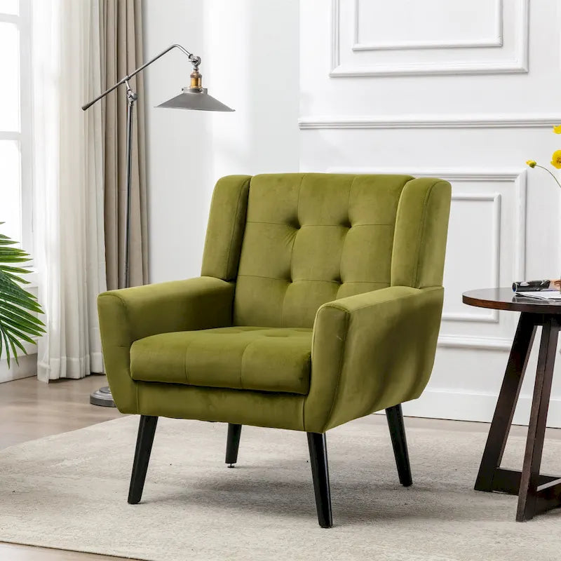 Poltroncina di design in velluto verde con gambe in legno nero, a sedile singolo