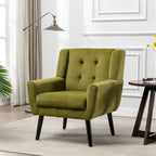 Poltroncina di design in velluto verde con gambe in legno nero, a sedile singolo
