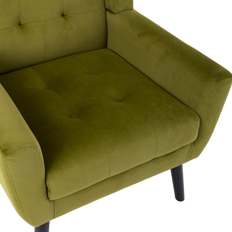 Poltroncina di design in velluto verde con gambe in legno nero, a sedile singolo
