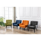 Poltroncina di design in velluto verde con gambe in legno nero, a sedile singolo
